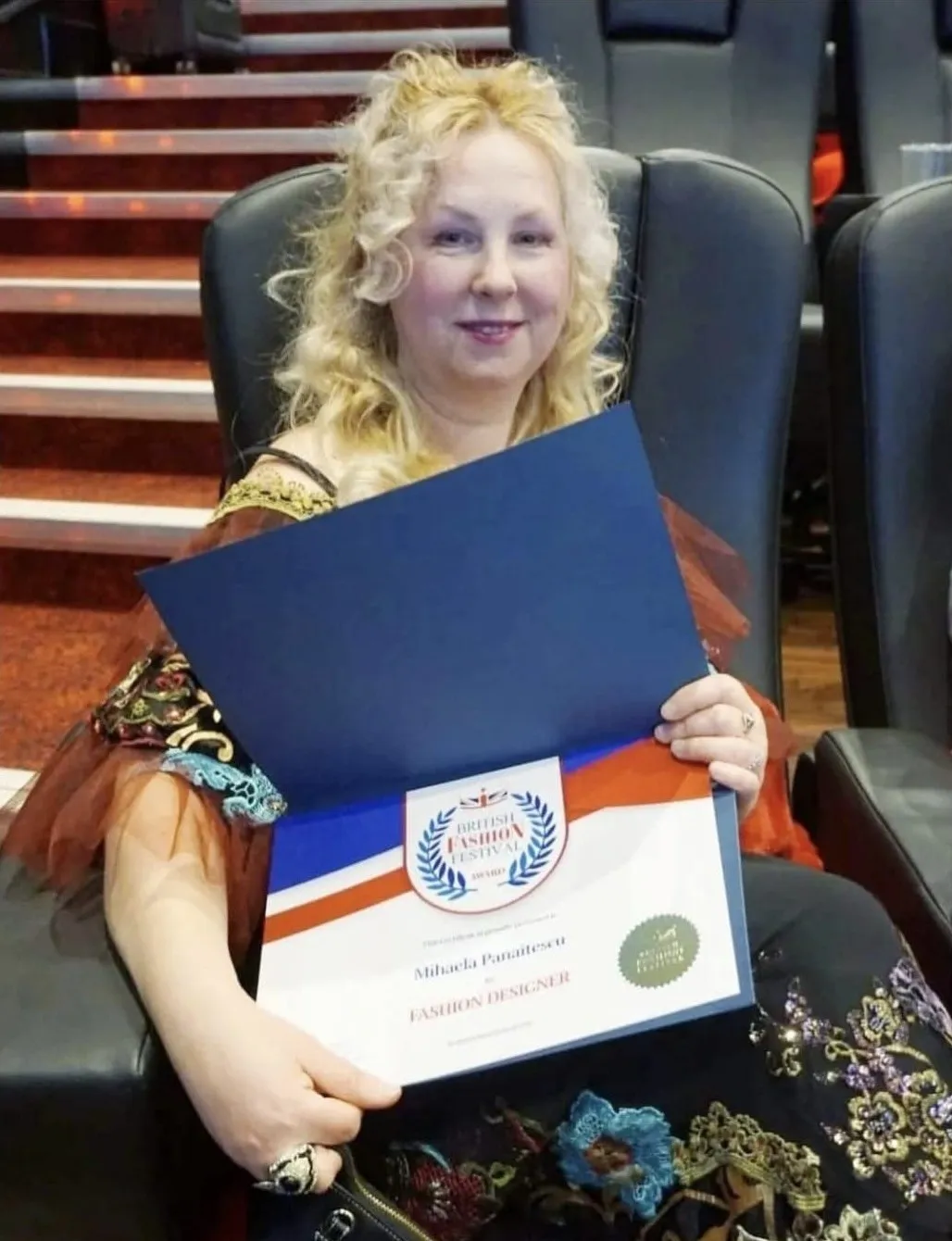 Mihaela Panaitescu with her British Fashion Festival certificate, Fashion Designer 2020