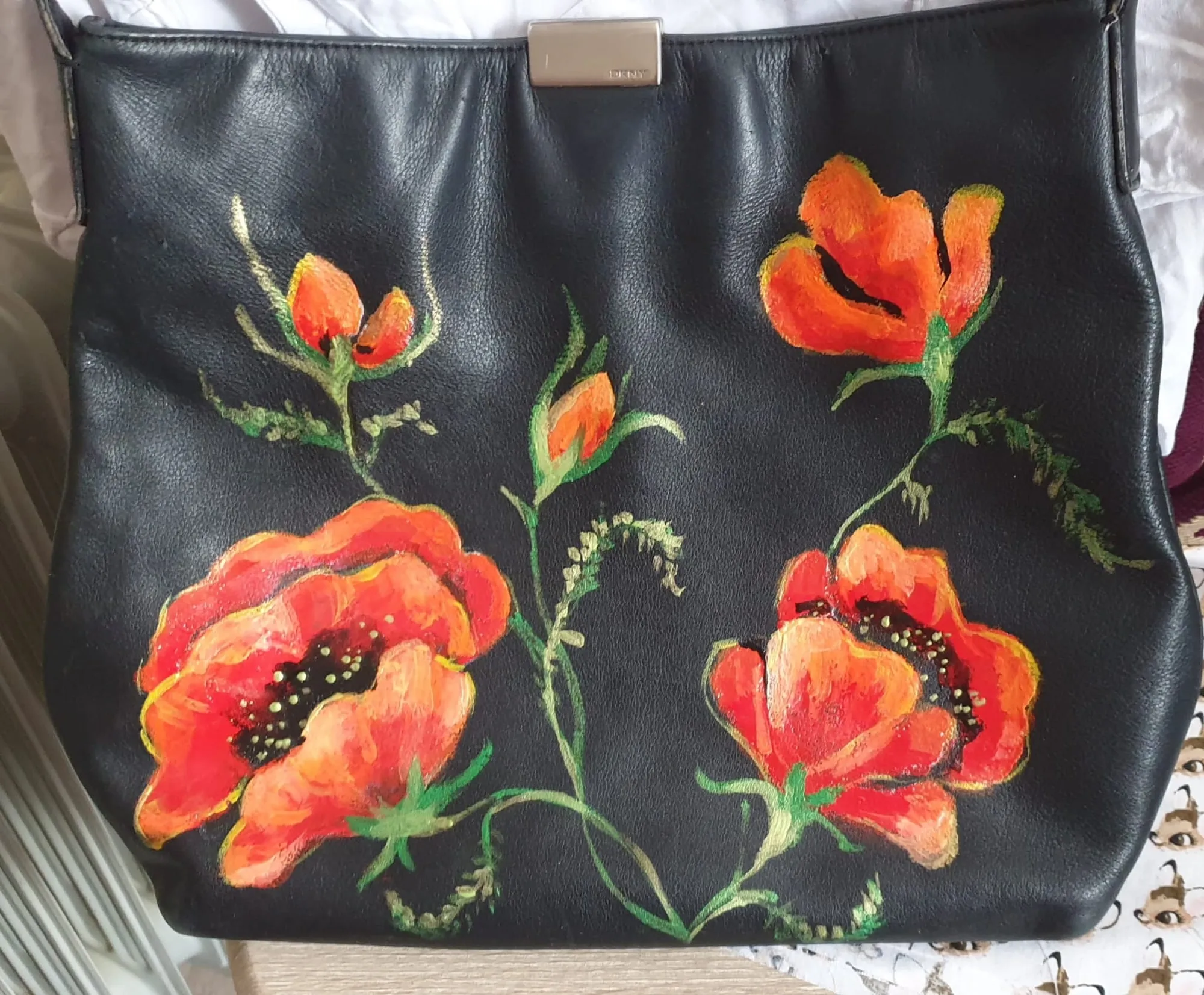 Black handbag hand-painted with red poppies
